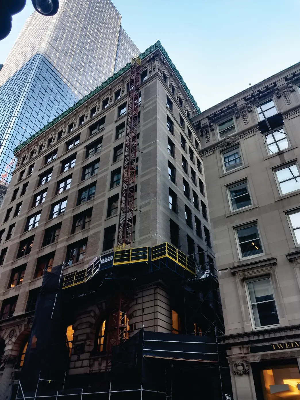 Caledonian Corporation crew restoring a commercial masonry facade in downtown Boston