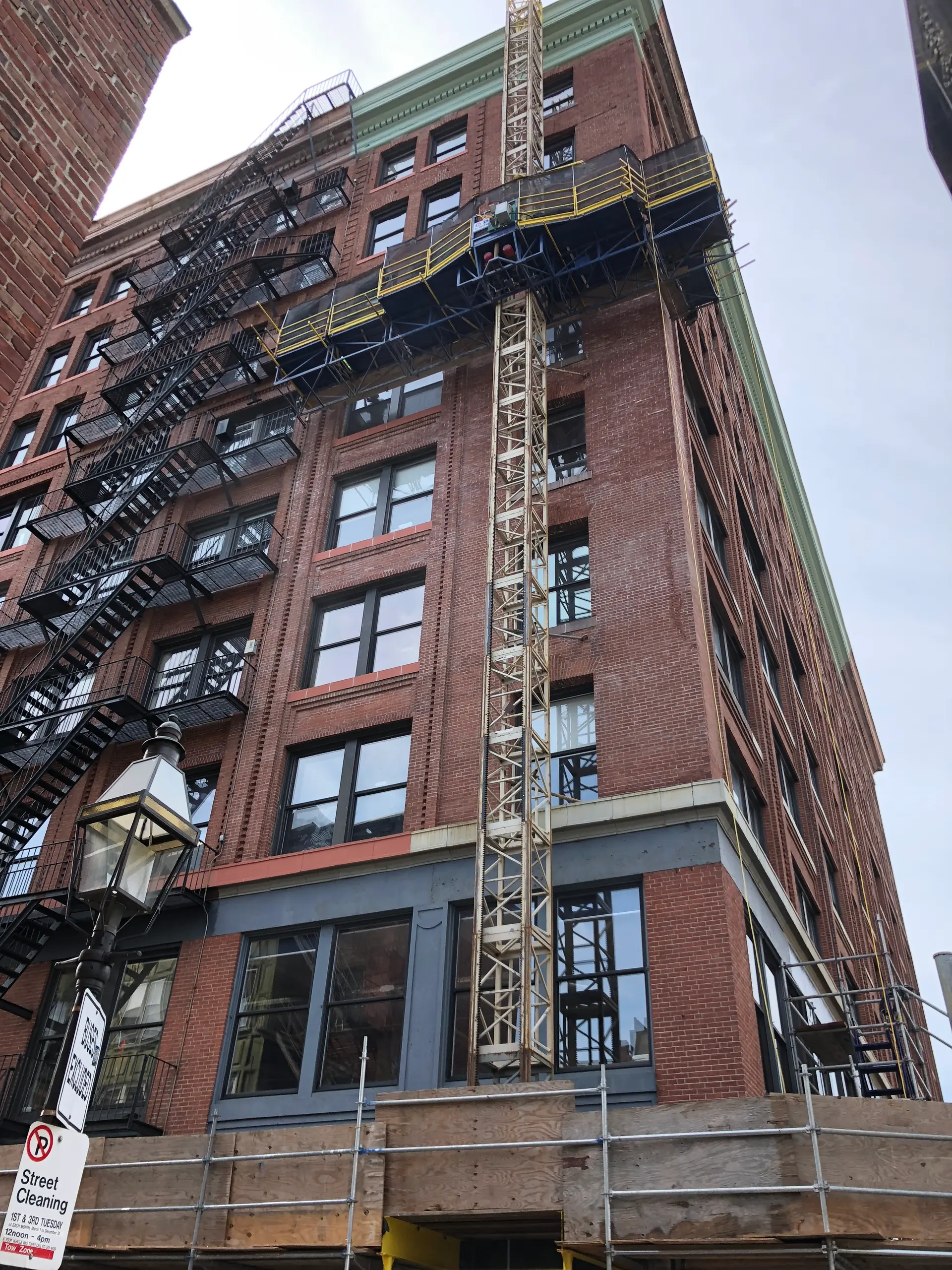 Brick facade restoration on a commercial building at 77 North Washington in Boston, Massachusetts